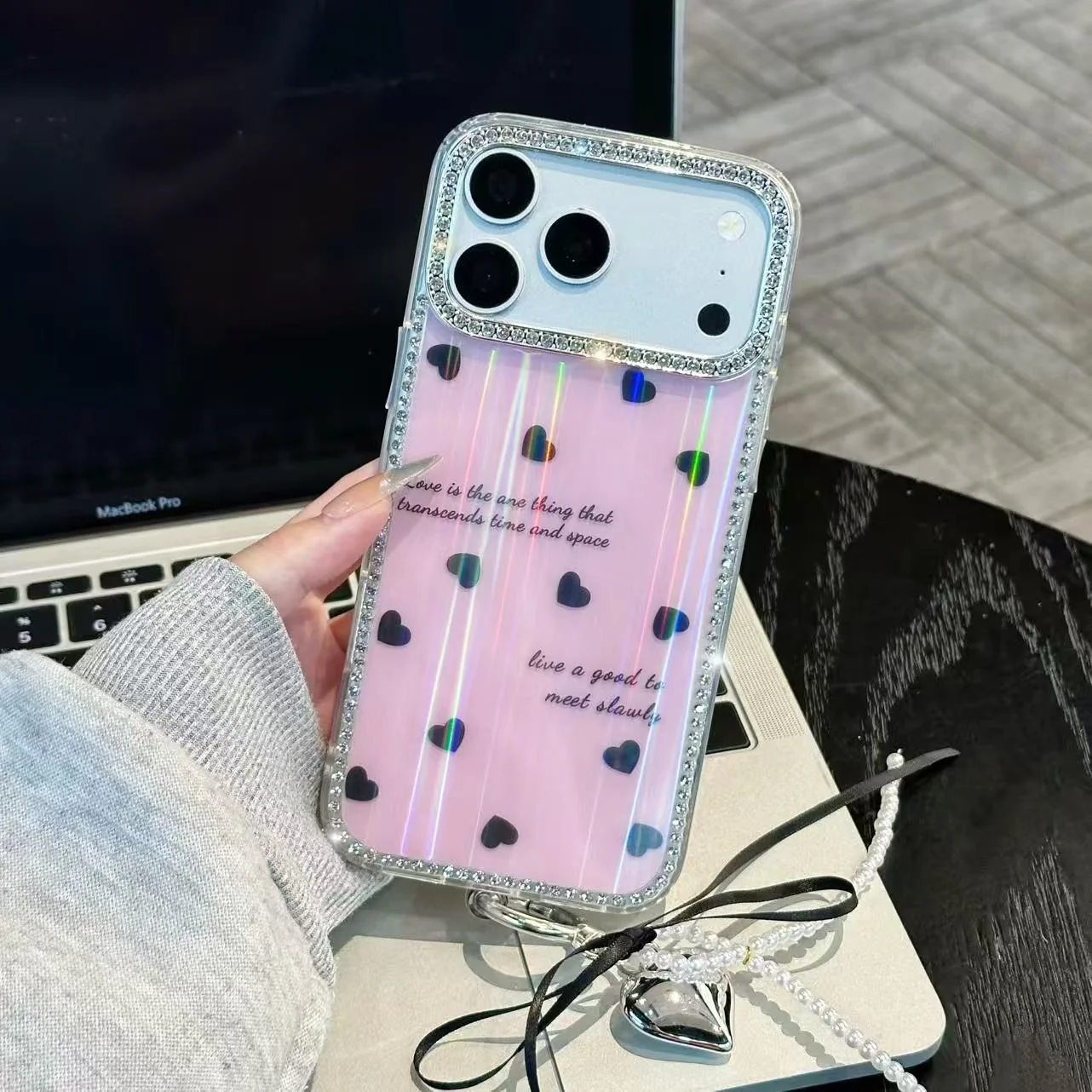 Pink patterned phone case with decorative hearts