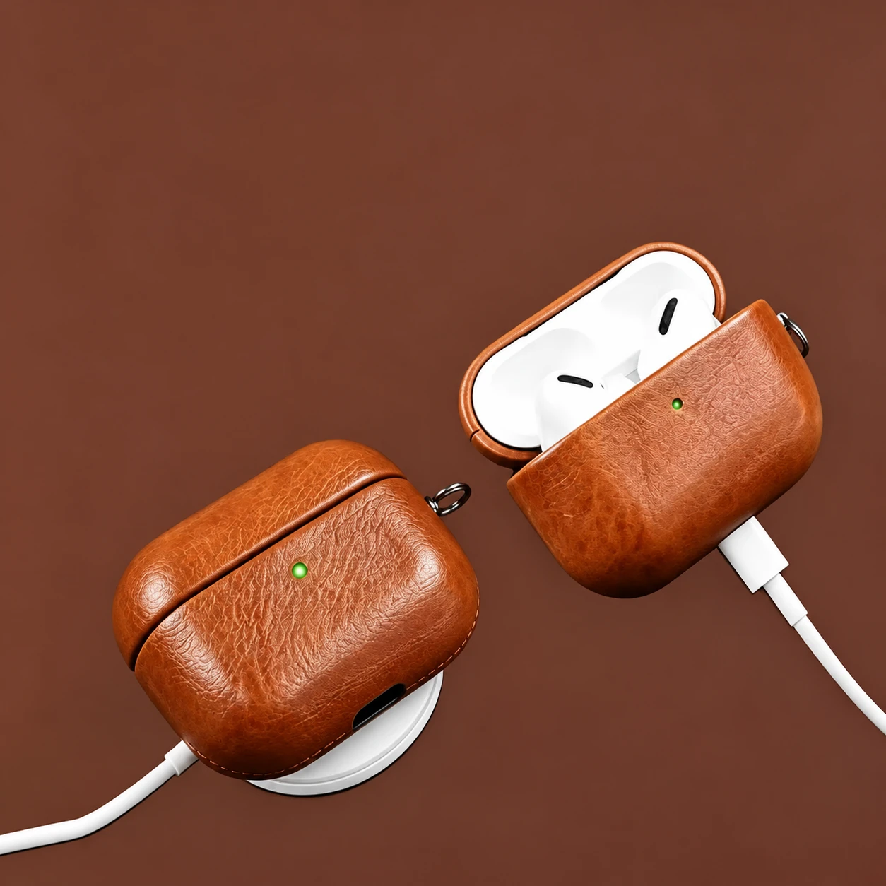 Brown leather earbud cases shown with wired and wireless charging